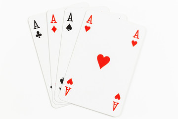 Four playing cards of Aces isolated on white background