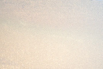 background ice, frozen window covered with frost in the sun, abstract silvery texture, gradient....