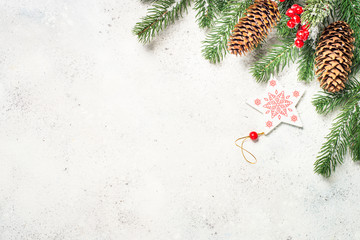 Christmas background with fir tree and decorations on white  bac