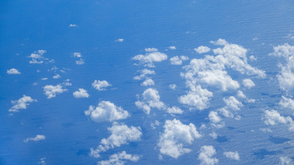 The view from an airplane. Clouds over the sea.