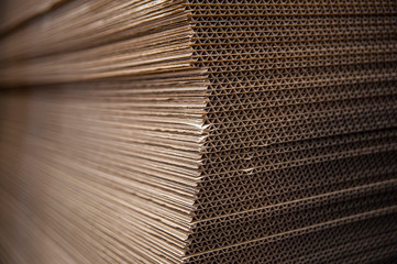 Corrugated cardboard sheets are one by one, they are prepared for the production of cardboard boxes