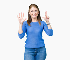 Fototapeta na wymiar Beautiful middle age mature woman wearing winter sweater over isolated background showing and pointing up with fingers number eight while smiling confident and happy.
