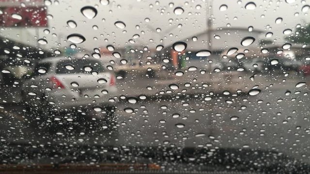 Rain drops on the windshield.