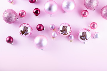 Christmas decorations on pink background, top view