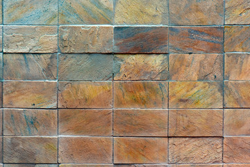 Wall of decorative stone plaques