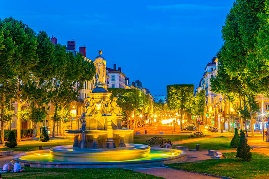 Night View Of A Fountain In A Park In Lyon, France