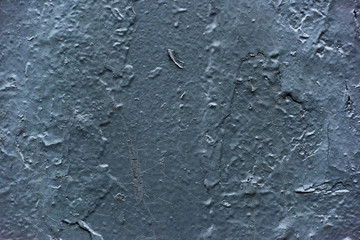 Texture of a scratched painted dark blue wall