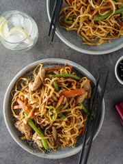 Asian noodles with pork in teriyaki sauce, with green beans, carrots and shiitake mushrooms.