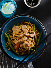 Asian noodles with pork in teriyaki sauce, with green beans, carrots and shiitake mushrooms.