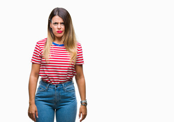 Young beautiful woman casual look over isolated background skeptic and nervous, frowning upset because of problem. Negative person.