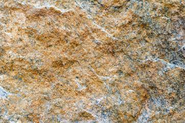 Natural yellow stone background texture close up