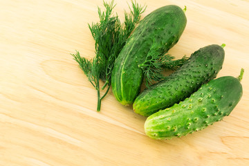 set of green fruits vegetables cucumbers background fresh bright on wooden cutting board making up salad