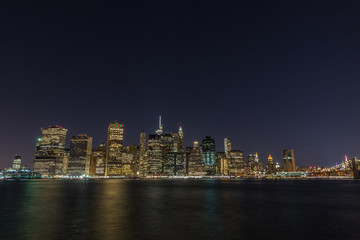 Fototapeta na wymiar Manhattan skyline panorama with Times Square lights at dusk, New York City