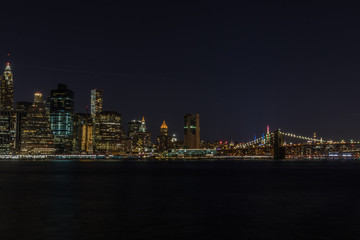 Manhattan skyline panorama with Times Square lights at dusk, New York City