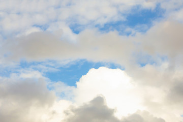 Fototapeta premium cumulus clouds lighted background airy light base relaxation relaxed with sunlight high in the sky