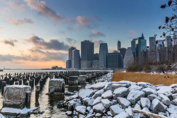 Foto op Canvas View of Manhattan at sunset from the side of the pier. © A_Skorobogatova