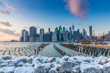 View of Manhattan at sunset from the side of the pier.