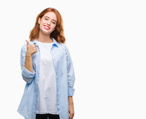 Young beautiful business woman over isolated background doing happy thumbs up gesture with hand. Approving expression looking at the camera with showing success.