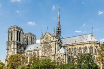 Notre Dame Cathedral, Paris, France, against a blue sky.