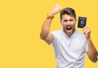 Young handsome man holding passport of united states over isolated background annoyed and...