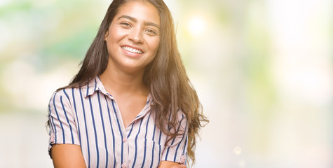 Obraz premium Young beautiful arab woman over isolated background happy face smiling with crossed arms looking at the camera. Positive person.