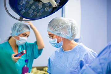 Surgeons team working in the hospital, operating room