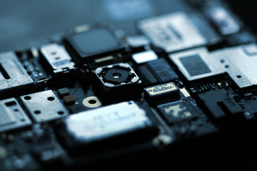 Close up zoom shot of mobile phone mother board with microchips and circuits. For phone repair service or center. 