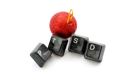 christmas decoration and text ptsd with old dirty computer buttons on white background, image
