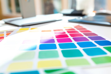 Desk with graphic design tools and accessories