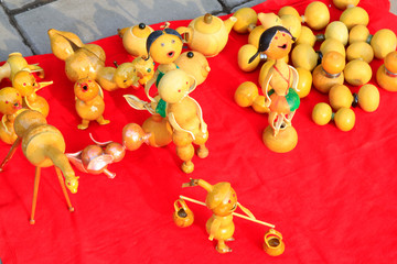 gourd crafts on red cloth