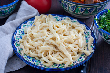 Cooked noodles made from wheat flour for lagman, horizontal