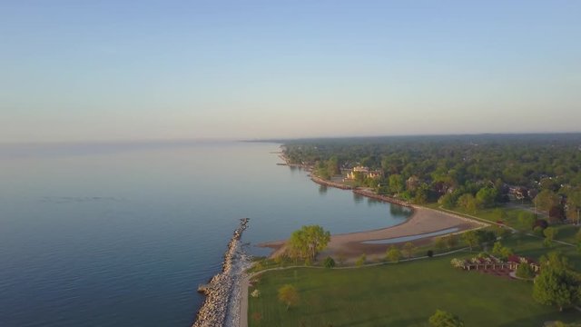 AERIAL: lifting past the harbor perpendicularly to the shoreline of Kenosha.