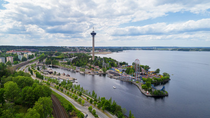 Fototapeta na wymiar Beautiful summer panorama of Tampere city at summer day. Lakeside amusement park .