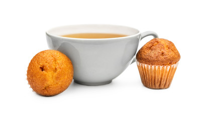 Cup of tea with small cupcakes on white.