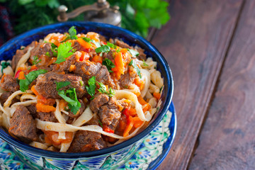 Traditional Uzbek Lagman with beef and vegetables, horizontal, copy space