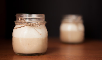 Delicious Dessert in a glass jar on a black background
