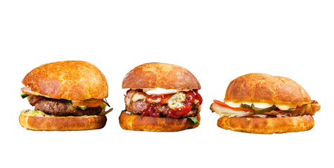 Three big burgers on white background. Isolated on white. Street food. Fast food