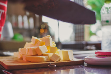 Chef cutting butter in kitchen,Bakery Concept.