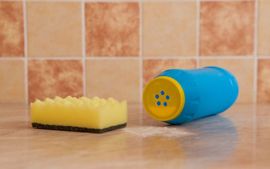 bright sponge and with dish washing liquid on marble background