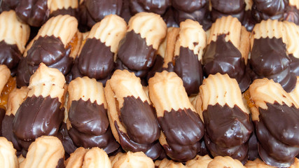 Assorted coffee cookies stuffed with marmalade and chocolate garnish