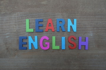 Fototapeta premium Learn english, motivational message with colored wooden words