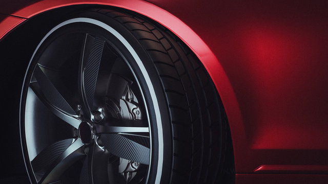 Fototapeta Close-up of a modern luxury car wheels.  Red Car. 3d rendering and illustration.