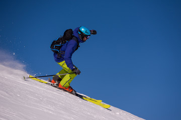 Skier having fun while running downhill