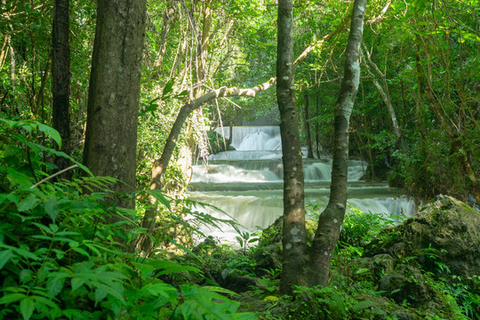 Fototapeta Tropical rainforest and waterfall at Huai Mae Khamin in Kanchanaburi, Thailand