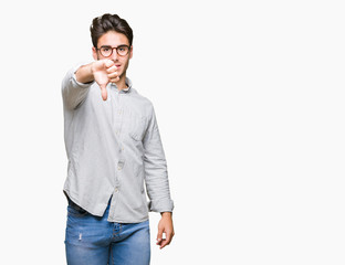 Fototapeta premium Young handsome man wearing glasses over isolated background looking unhappy and angry showing rejection and negative with thumbs down gesture. Bad expression.