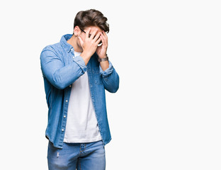 Young handsome man wearing sunglasses over isolated background with sad expression covering face with hands while crying. Depression concept.