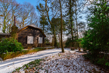 a cottage in a snowy forest a snowy forest