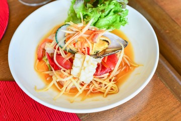 Close-Up View of Thai Spicy Seafood Papaya Salad or Som Tam
