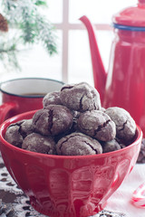 Homemade chocolate cookies with cracks. Biscuits with icing sugar. Selective focus