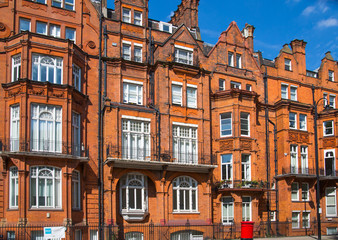 Fototapeta na wymiar London, UK. Residential area of Kensington and Chelsea. Row of periodic buildings. 